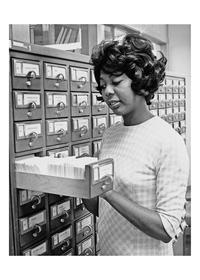 Photograph of Black Studies Librarian Rubye Ballard at the card catalog, 1971