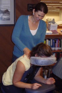 student getting a chair massage