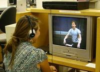 student watching a dvd