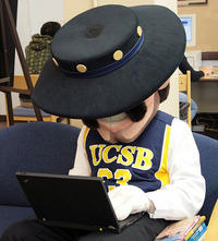 USCB mascot, Ole, using a laptop