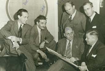 Photograph is Carlton E. Morse (seated, second from right) on the set for One Man's Family.