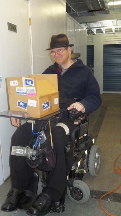 Mark Hendrix opening a new shipment of records for his collection