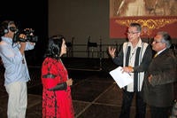 Photograph of Dan Guerrero directing ¡Adelita! with Luis Valdez & Dolores Huerta