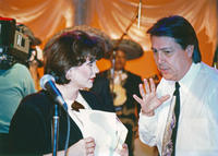 Photograph of Dan Guerrero directing singer Linda Ronstadt, 1992