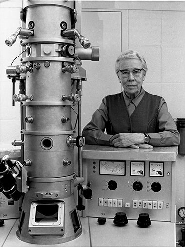 Dr. Katherine Esau with a microscope in her laboratory