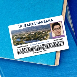 UCSB access card for a staff member on a stack of books