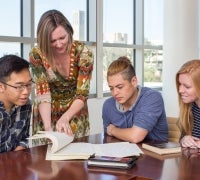 Faculty working with students