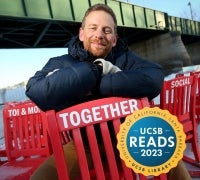 Charles Montgomery sitting on a red chair