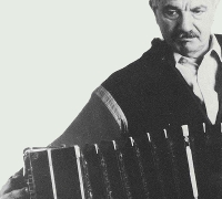 Close up of Astor Piazzolla playing the accordion