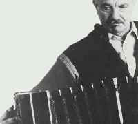 Close up of Astor Piazzolla playing the accordion