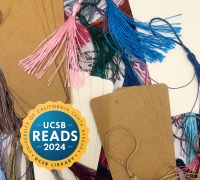 Scattered blank bookmarks and colorful tassels