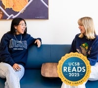Two people sitting on a couch in conversation
