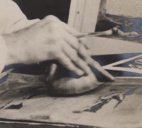 Pierre Crampe uses a round-bristled brush to apply a color wash through a zinc stencil
