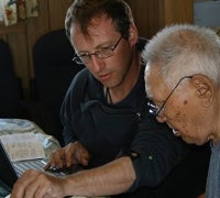 Aaron Fox working through Boulton recordings with the late Iñupiaq elder and music expert Warren Matumeak. 