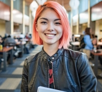 Female student smiling in Library 