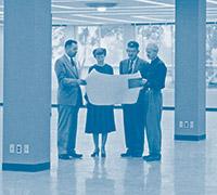 Looking over floor plans in the newly completed original Library are (from left to right) Frazer G. Poole, Head of the Service Department; Katherine C. McNabb, Head of the Cataloging Department; Donald C. Davidson, University Librarian; and Porter Varney,