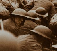 Soldiers of the 9th Cameronians (Scottish Rifles) wait to go “over the top” on a trench raid near Arras, France. 24 March 1917. 